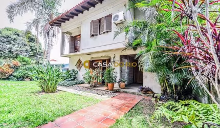 Casa em condomínio fechado com 4 quartos à venda na Acesso das Orquídeas, 93, Santa Tereza, Porto Alegre por R$ 520.000