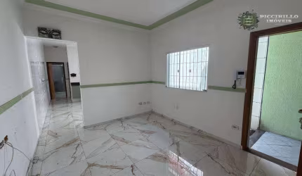 Casa com 2 dormitórios à venda, 71 m² por R$ 420.000 - Maracanã - Praia Grande/SP