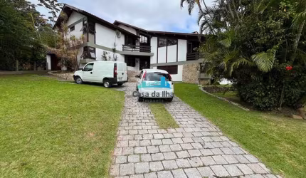 Casa em condomínio fechado com 4 quartos à venda no Cacupé, Florianópolis  por R$ 2.900.000