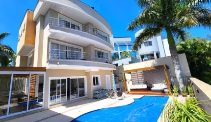 Elegante casa em condomínio para venda com 4 quartos, sendo 4 suítes, 710m²