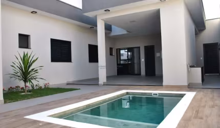 Casa térrea no condomínio D Lucila, 3 suítes, piscina aquecida, cozinha com planejados e cooktop, área gourmet com churrasqueira e planejados