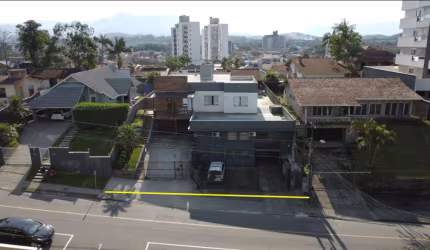 Terreno com casa e galpão Comercial Costa e Silva Joinville.