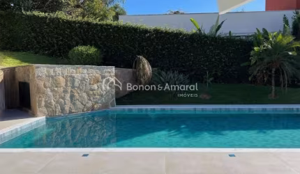 Casa em condomínio com 402 m² e 4 suítes
