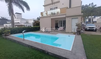 Casa em condomínio fechado com 3 quartos à venda na Rua Leonel Pereira, 2239, Cachoeira do Bom Jesus, Florianópolis, 320 m2 por R$ 2.100.000