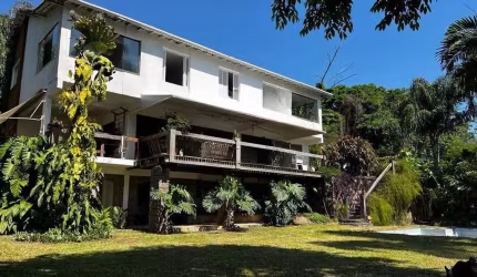 Casa em condomínio fechado com 4 quartos à venda na Estrada de Jacarepaguá, 2176, Itanhangá, Rio de Janeiro por R$ 1.700.000
