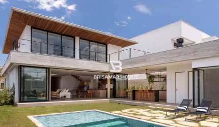 CASA DE ALTO PADRÃO EM CONDOMÍNIO PRIVILEGIADO NO GUARUJÁ – 5 SUÍTES, ÁREA GOURMET E BEACH HOUSE