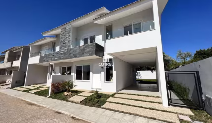 Casa em condomínio fechado com 3 dormitórios, suíte e 2 vagas de garagem