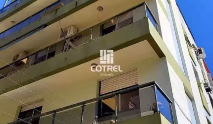 Apartamento semimobiliado com 2 dormitórios, suíte e garagem no Edifício Votron