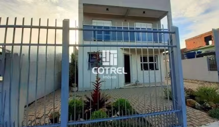Casa 4 dormitórios 1 suíte 2 vagas de garagem localizada no Bairro Urlândia na c
