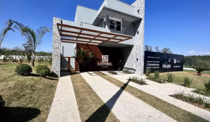 Casa em condomínio fechado com 3 dormitórios, suíte e 2 vagas de garagem