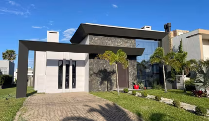 Casa em condomínio fechado com 3 quartos à venda na Rua Onório Germano, 2009, Araça, Capão da Canoa por R$ 1.200.000