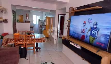 Apartamento com 2 quartos, 1 suíte , 1 banheiro social e garagem.