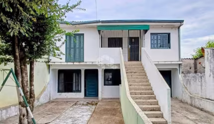 Casa a venda com 7 quartos, 5 dormitórios garagem para 2 carros no Bairro Juscelino Kubitschek