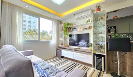 Apartamento, 63 m² de área privadas, 2 dormitórios, living com 3 ambientes e uma vaga de garagem, semi-mobiliado. Aceita Financiamento e FGTS.
