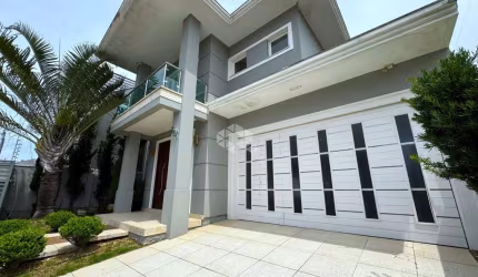 Casa com 3 dormitórios, sendo 3 suítes, 4 vagas, no Bairro Marechal Rondon em Canoas - RS.