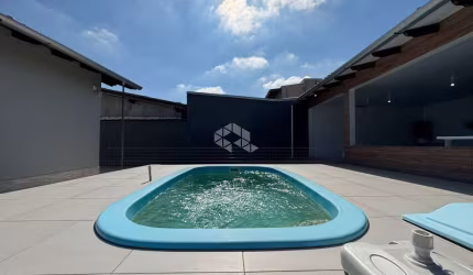 Casa com 3 dormitórios, mobiliada, com Piscina, sendo 174m² privativos no Bairro Nossa Senhora das Graças, em Canoas/RS.