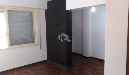 Apartamento de um dormitório semi mobiliado  no centro