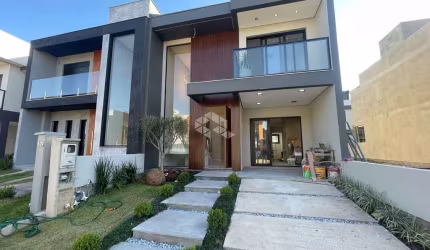Alto padrão no Central Square - Gravataí! Casa com 138m², 3 dormitórios (1 suíte), lareira, churrasqueira, cozinha planejada, iluminação completa e ja