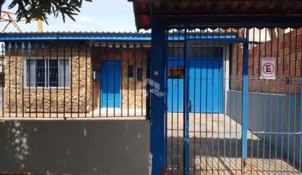 Terreno com 3 casas à venda no bairro Mathias Velho
