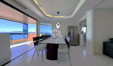 Apartamento Frente Mar com 4 dormitórios e 3 vagas de garagem em Meia Praia Itapema/SC
