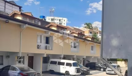 CASA EM CONDOMINIO FECHADO 2 DORMITORIOS NA VILA SANTOS