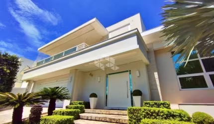 Casa com 4 suítes no bairro Santa Mônica