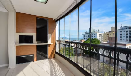 APARTAMENTO COM VISTA MAR SEMIMOBILIADO COM 3 QUARTOS SENDO 1 SUÍTE 2 VAGAS DE GARAGEM NO BAIRRO COQUEIROS EM FLORIANÓPOLIS/SC