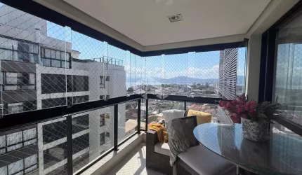 APARTAMENTO SEMIMOBILIADO COM VISTA PARA O MAR COM 2 QUARTOS SENDO 1 SUÍTE E 2 VAGAS DE GARAGEM NO BALNEÁRIO EM FLORIANÓPOLIS/SC