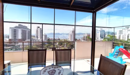 COBERTURA COM 3 QUARTOS SENDO 1 SUÍTE VISTA MAR E TERRAÇO NO CANTO EM FLORIANÓPOLIS