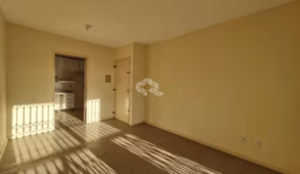 Apartamento 2 dormitórios, sacada, 1 vaga de garagem no bairro São João, em Porto Alegre. Aceita financiamento e FGTS.
