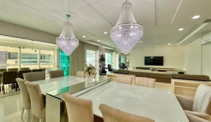 Apartamento com 4 suítes e 3 vagas de garagem na Meia Praia em Itapema