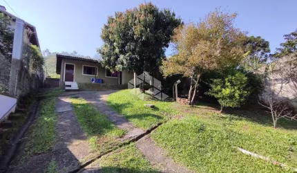 Terreno com 3 casas em Estância Velha