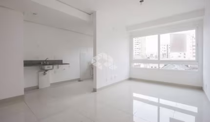 Apartamento de 2 dormitórios com vaga, bairro Cidade Baixa em Poa/Rs.