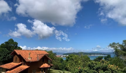 Terreno a venda  com dois sobrados em Canajurê com vista mar