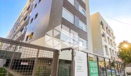 Apartamento dois dormitórios, garagem e elevador, edificio novo