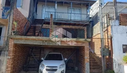 Casa à venda com 3 quartos/dormitórios, 2 vagas no bairro Santo Antônio em Porto Alegre.