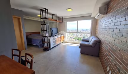 Studio de 45m2, living, cozinha com churrasqueira, banheiro social, mobiliado