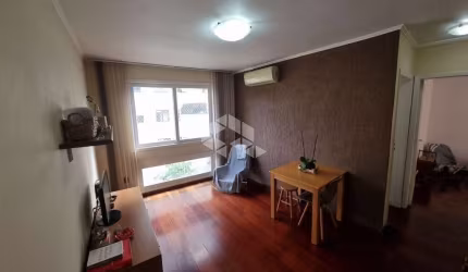Excelente Apartamento de 2 dormitórios com vaga de garagem coberta e escriturada no bairro Auxiliadora