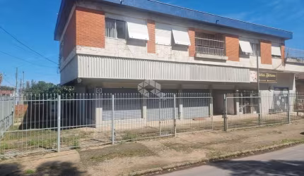 Excelente Prédio com Amplo Apartamento com 3 dormitórios, suíte no segundo andar com garagem e 3 lojas grandes no térreo em avenida no bairro Sarandi
