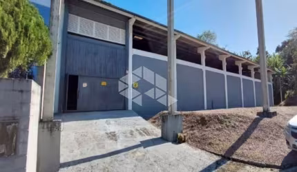 PAVILHÃO NO BAIRRO POTECAS, EM SÃO JOSÉ, SC, MEDINDO 1,100M² DE ÁREA TOTAL.