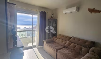 APARTAMENTO NO BAIRRO BARREIROS, EM SÃO JOSÉ, SC, VISTA MAR, SEMI-MOBILIADO, SACADA, CHURRASQUEIRA, 03 QUARTOS SENDO 01 SUÍTE, 01 VAGA DE GARAGEM