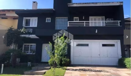 CASA EM CONDOMINIO 4 DORMITÓRIOS, 3  vagas, sendo 2 cobertas, segurança, piscina, trilha, churrasqueiras, bairro Lomba do Pinheiro em Porto Alegre.