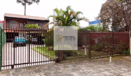 Sobrado  no  Bacacheri, 2 suites, 6 quartos sendo 2 no térreo.