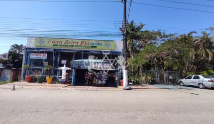 Galpão comercial à venda e locação, em frente ao Shopping Serramar, com construção residencial e po