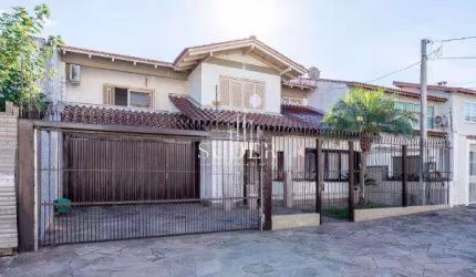 Casa com 5 quartos à venda na Rua Walir Zottis, 193, Jardim Planalto, Porto Alegre por R$ 1.490.000