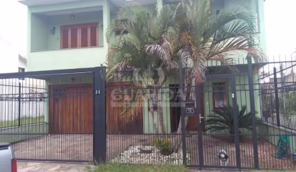 Casa com 3 quartos à venda na Rua Louro, 34, Hípica, Porto Alegre por R$ 745.000