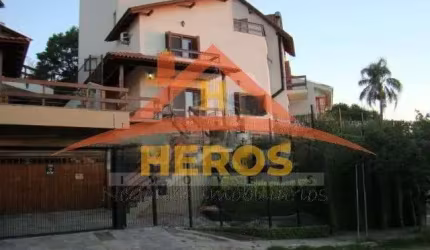 Casa com 4 quartos à venda na Rua Arachanes, 183, Espírito Santo, Porto Alegre por R$ 1.100.000