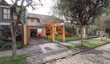 Casa com 3 quartos à venda na Rua Ítalo Brutto, 410, Espírito Santo, Porto Alegre por R$ 690.000