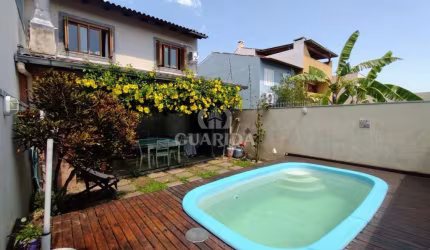 Casa com 3 quartos à venda na Rua Attilio Bettio, 92, Aberta dos Morros, Porto Alegre por R$ 585.000