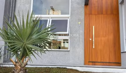 Casa com 3 quartos à venda na Rua Nelson Cidade de Souza, 160, Loteamento Jardim Timbaúva, Gravataí, 102 m2 por R$ 899.000